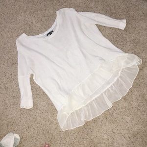 White ruffled sweater